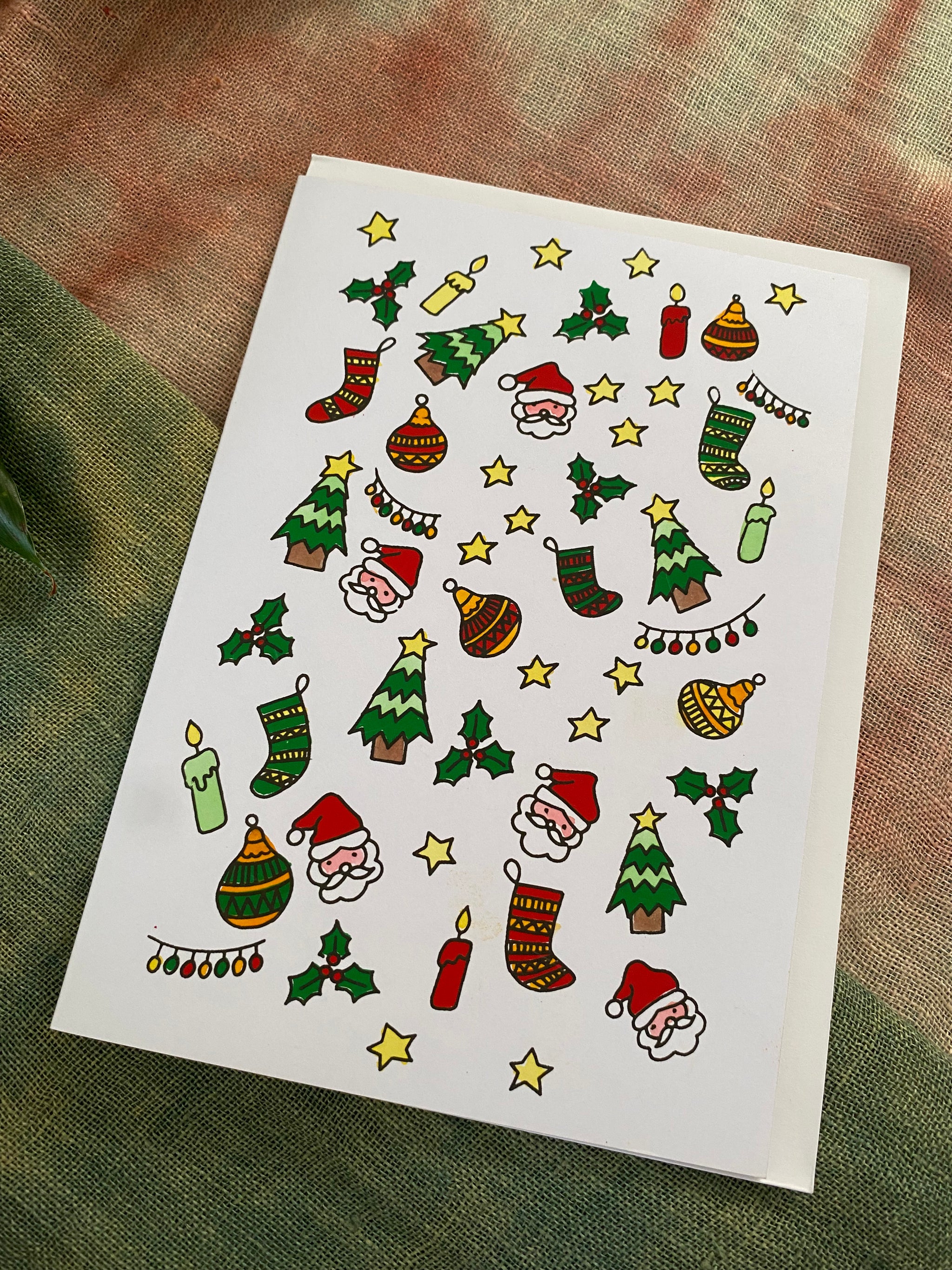 Christmas-themed icons on a christmas card textured surface