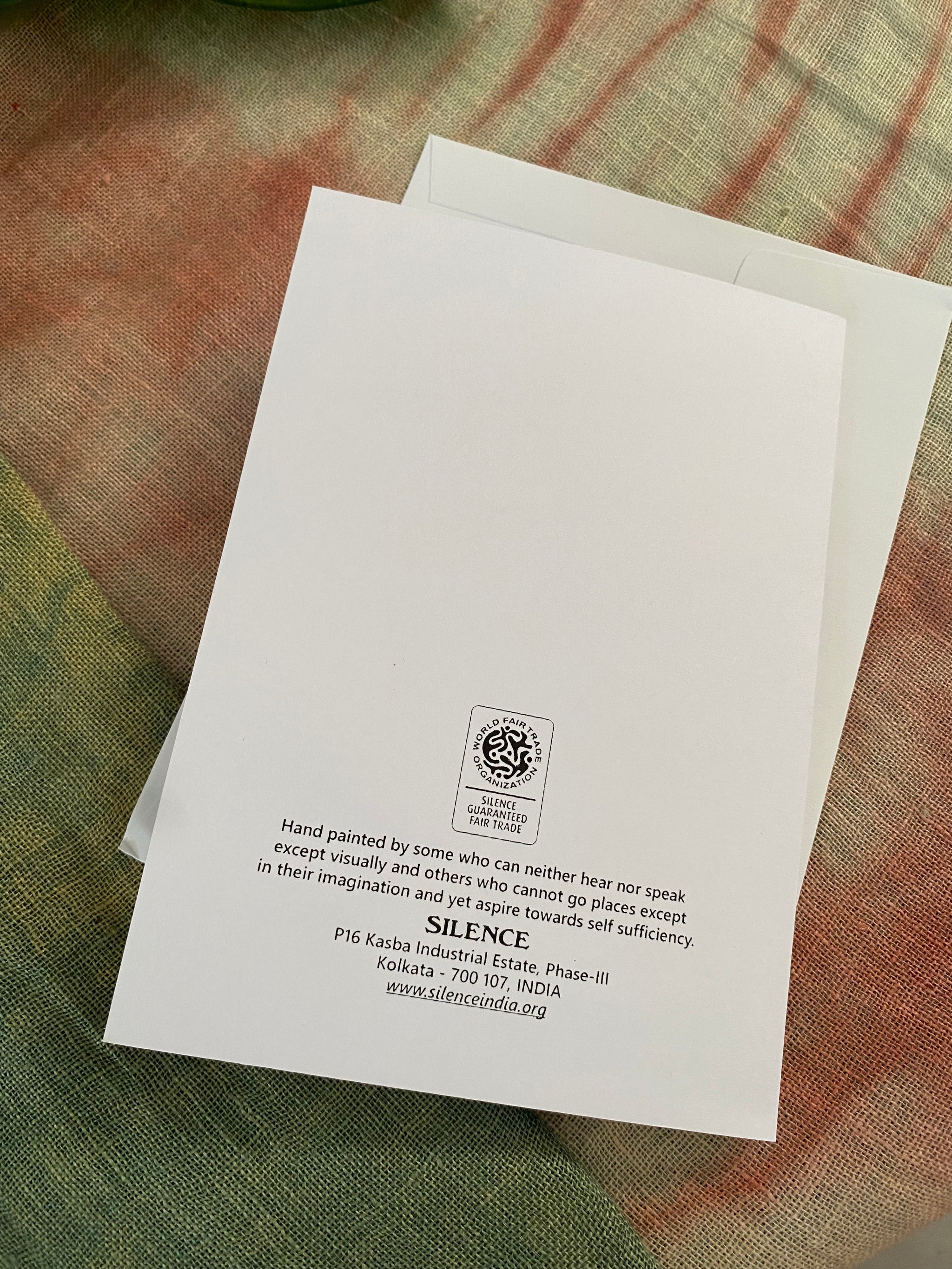 white card with text story and a wfto logo on the back