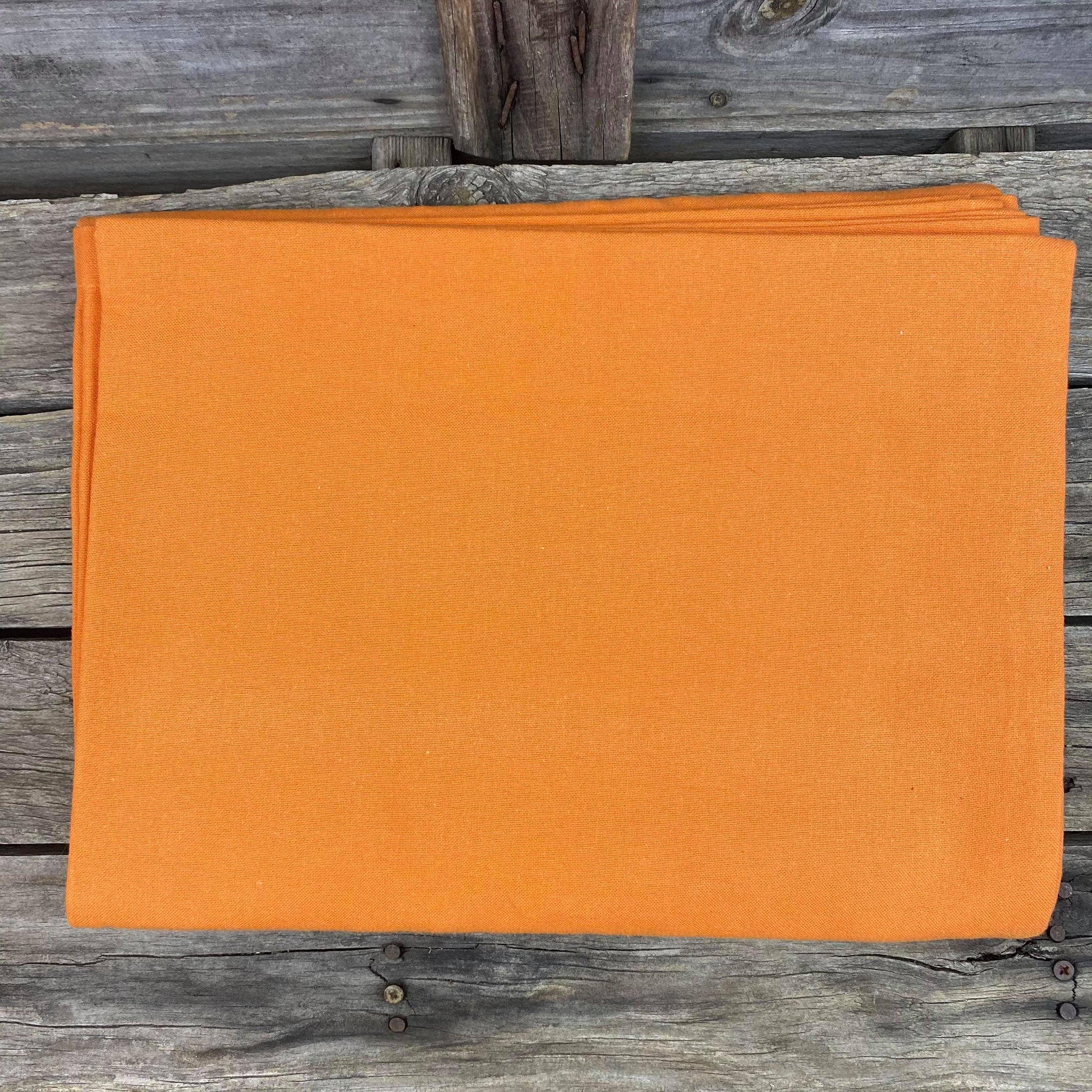 Fair trade ethical handwoven table cloth in a tiger orange colouring