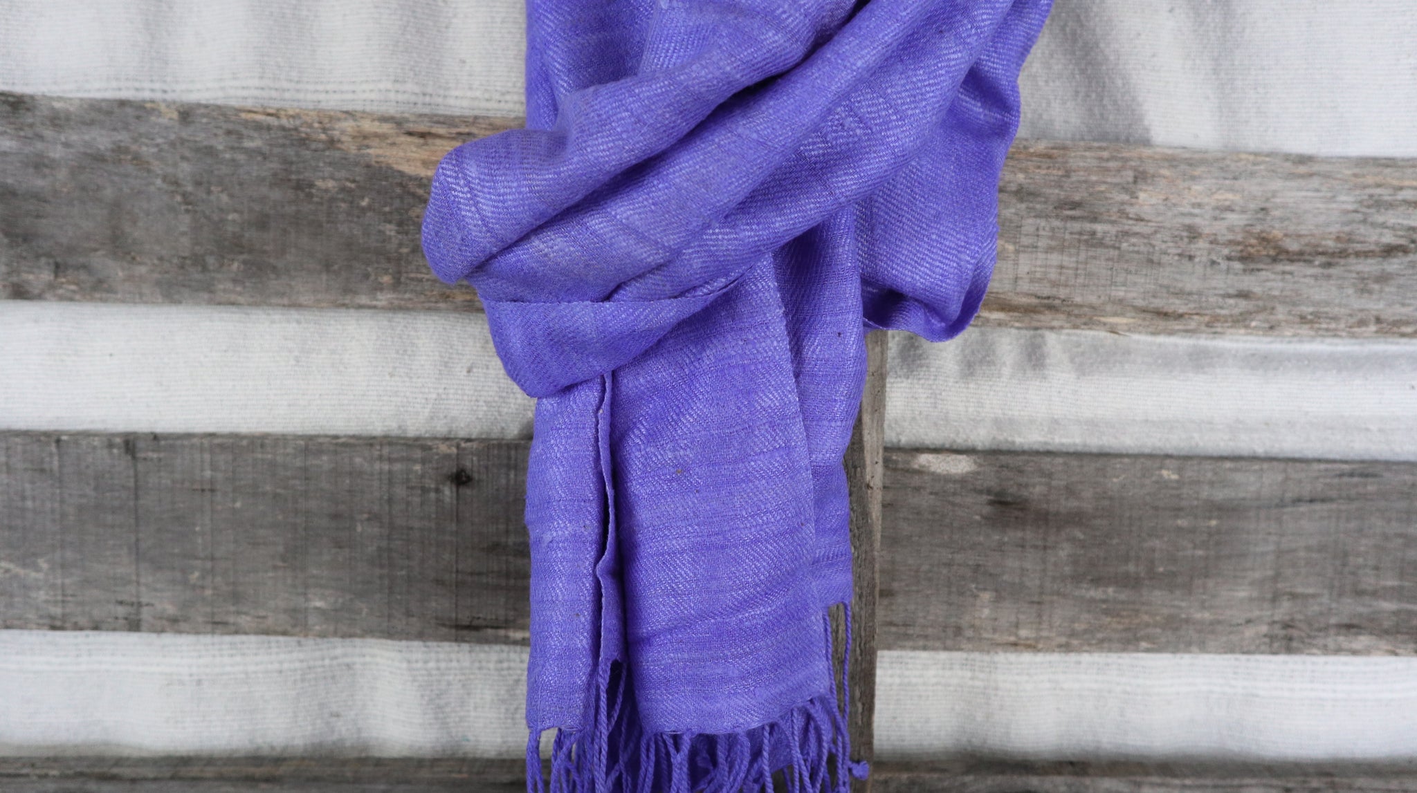 detail of the natural fibers of the raw silk from the violet scarf