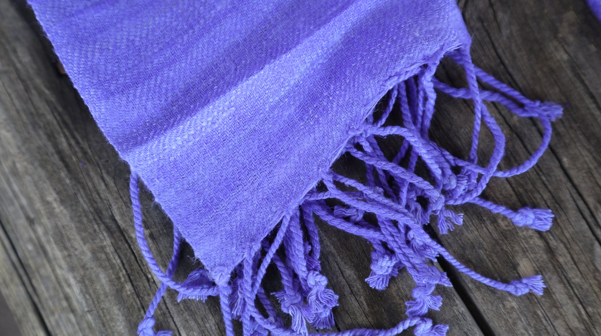 Detail of the tassels of the violet scarf