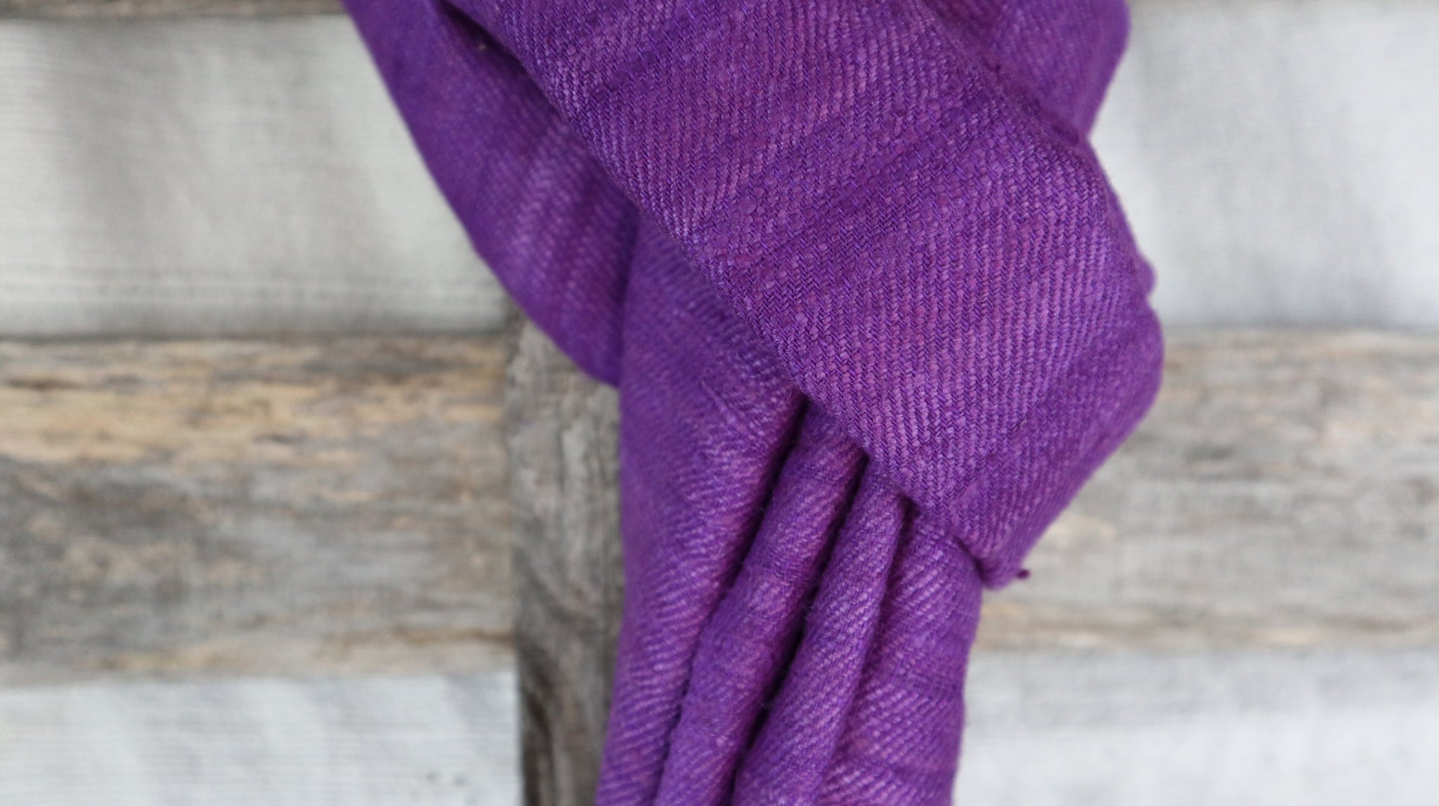 detail of the natural fibers of the raw silk from the purple scarf