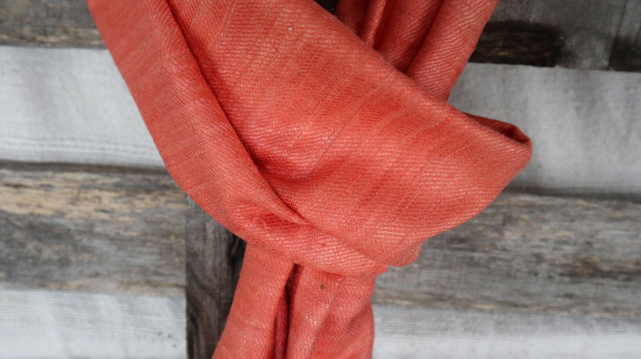 detail of the natural fibers of the raw silk from the peach scarf