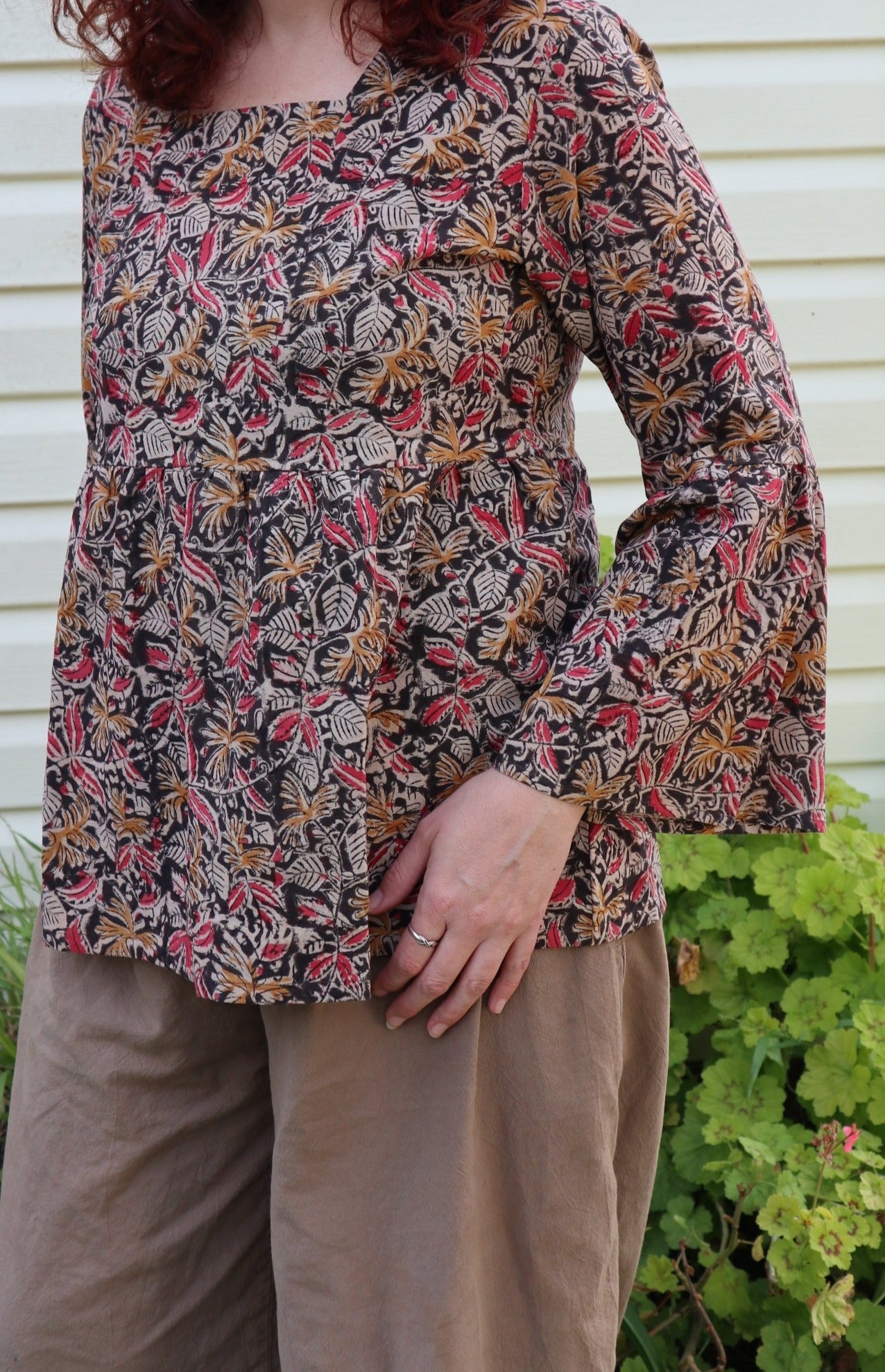 Fair trade ethical bell sleeve top with square neck, ebony patterned design with traditional Indian Tanjore Art - women, leaves and flowers are displayed