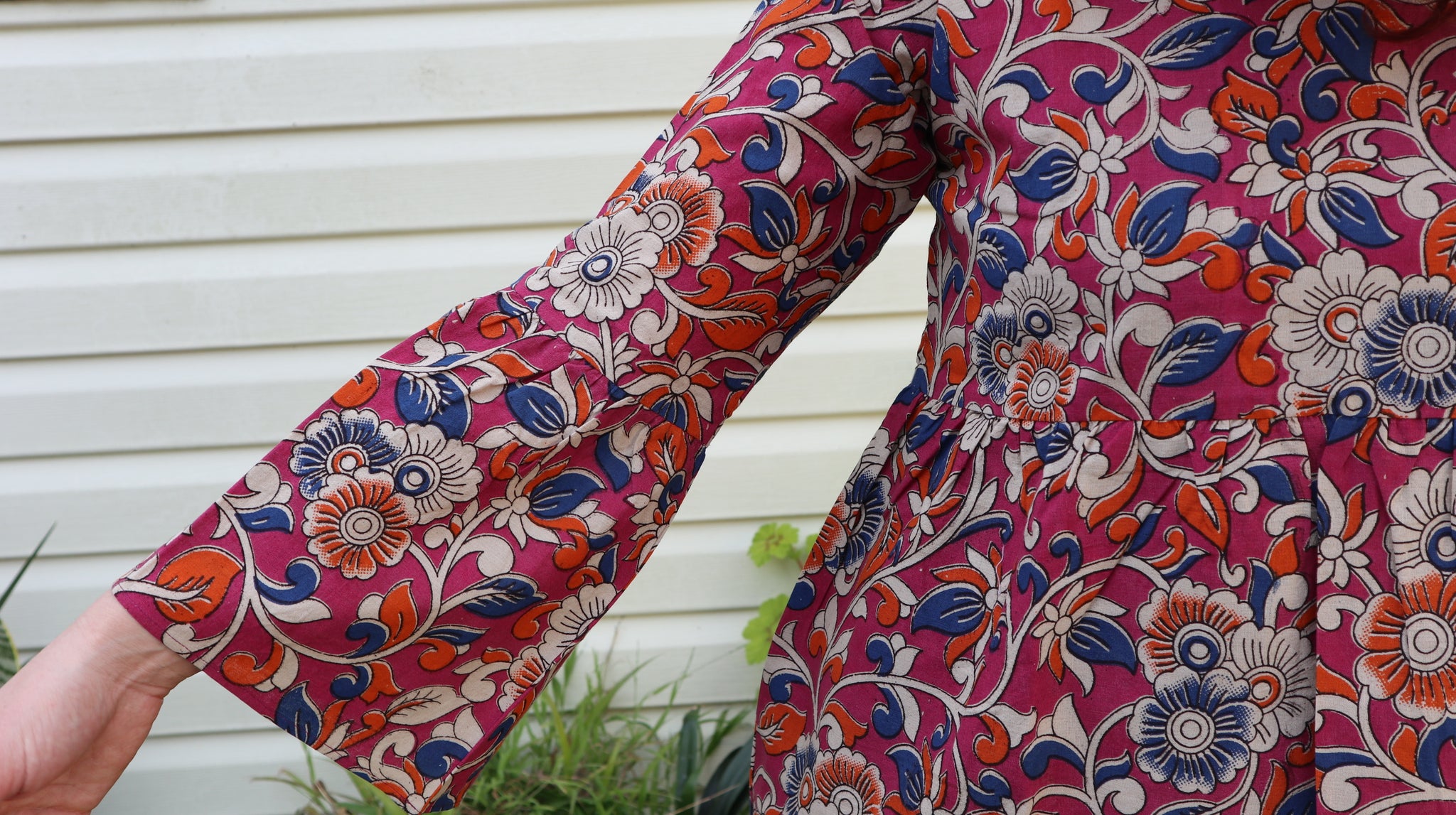 Fair trade ethical bell sleeve top with square neck, an orchid purple patterned design with traditional Indian Tanjore Art - vines with various flowers of blue and orange colours are displayed
