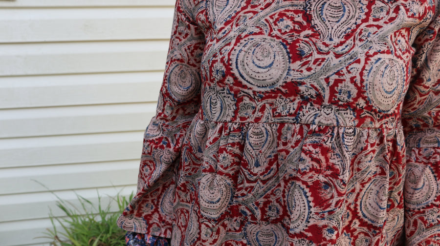 Fair trade ethical bell sleeve top with square neck, Red patterned design with traditional Indian Tanjore Art - branches with abstract fruit and leaves are displayed
