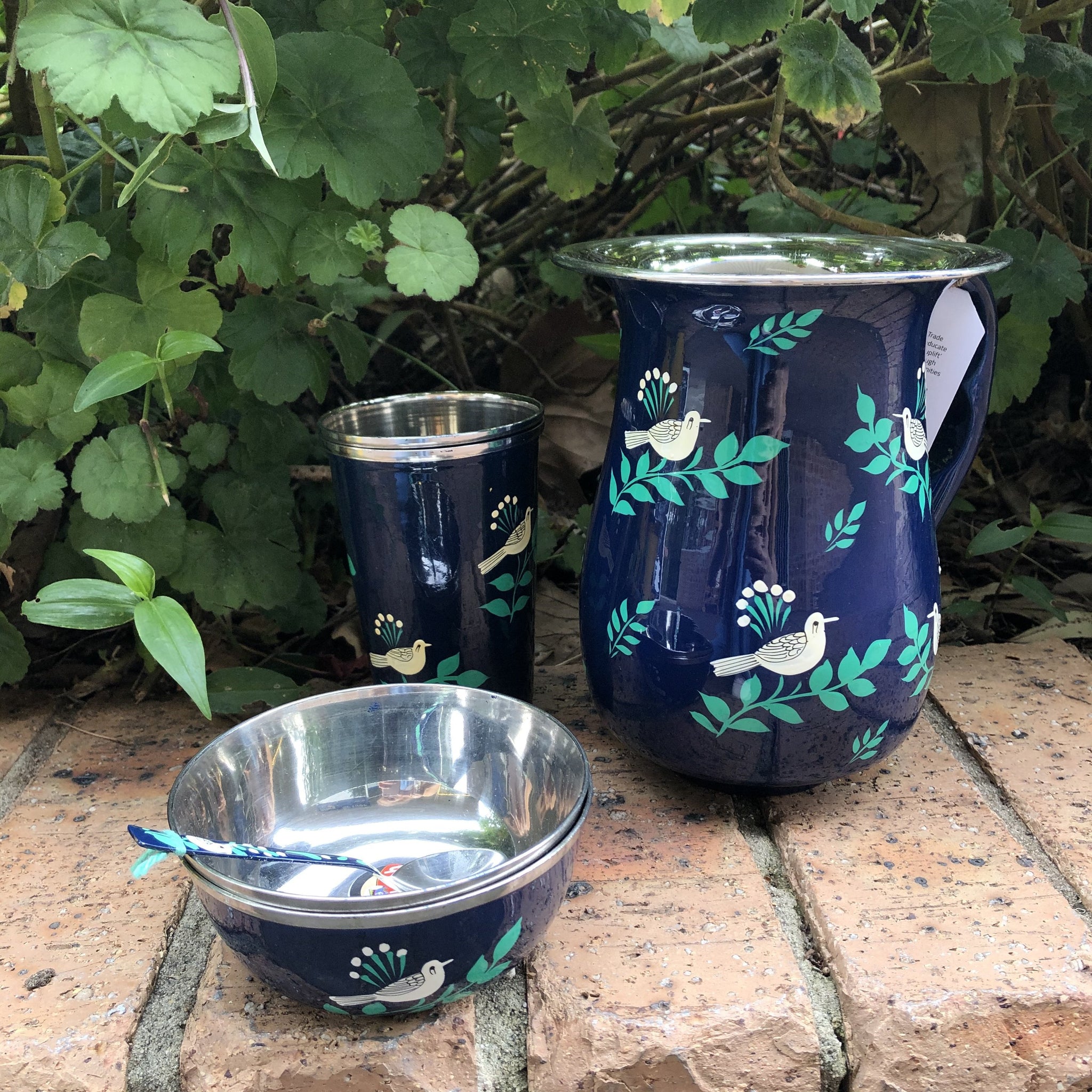 Fair Trade Hand Painted Enamelware - Navy Bird Collection. Pictured: Matching jug, cup, bowl and spoon set.