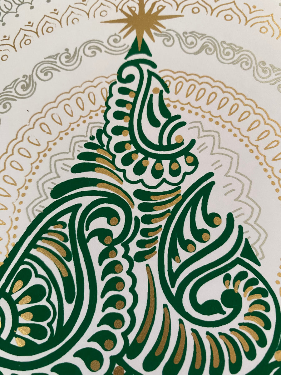 Greeting card with a decorative Christmas tree design on a textured surface