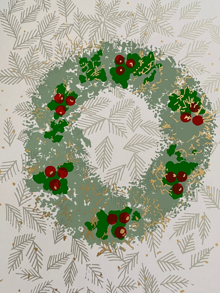 Greeting card with a Christmas wreath design on a textured fabric background