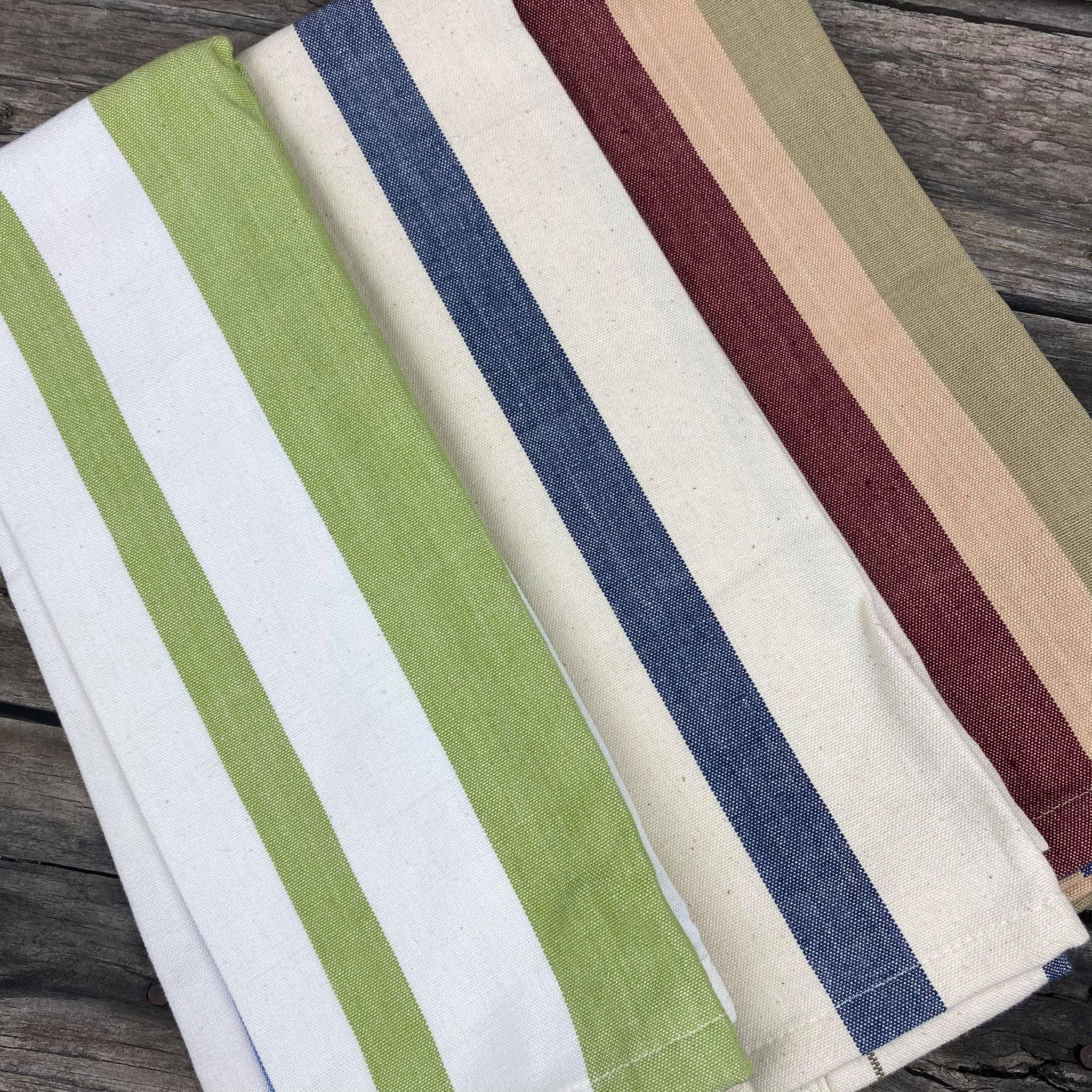 Fair trade ethical handwoven striped cotton tea towels in green, blue and a maroon, beige and green colouring 