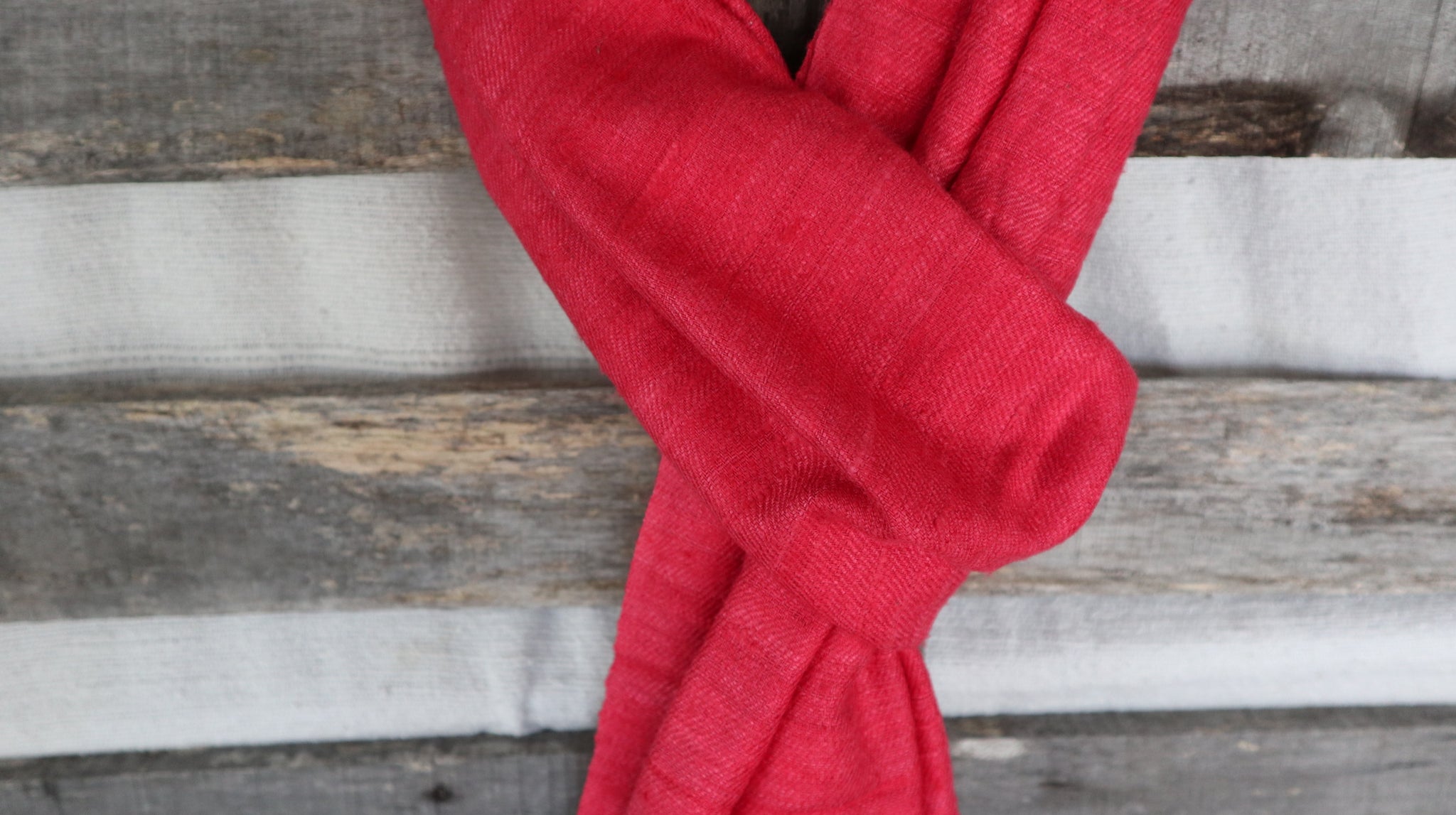 detail of the natural fibers of the raw silk from the red scarf 